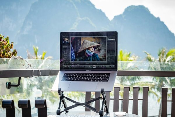 a laptop computer sitting on top of a table