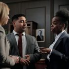 Diverse professionals engaged in strategic discussion in a law office setting.
