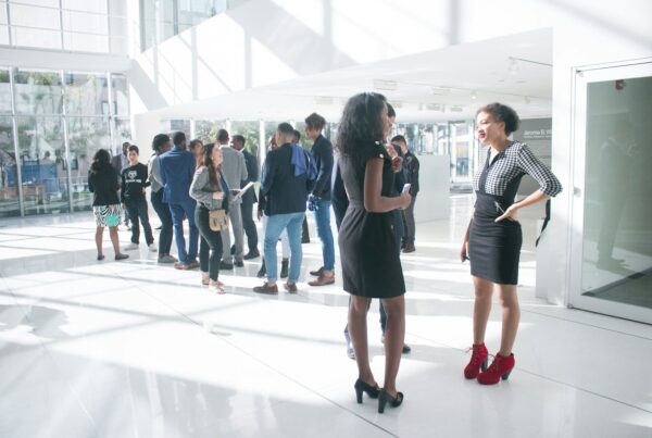 a group of people standing in a room